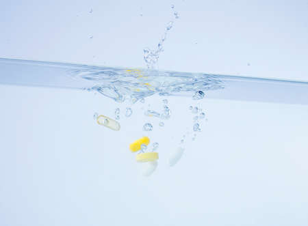 The moment the medicine falls into the waterの写真素材