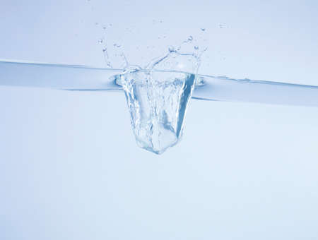 The moment the ice falls into the waterの写真素材