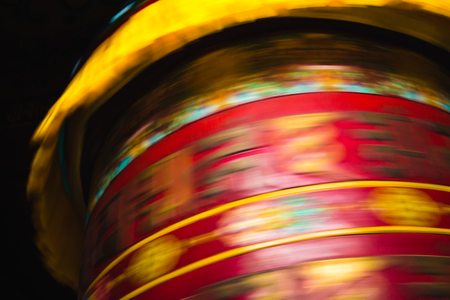 Close up, abstract, of a very large Buddhist prayer wheel spinning. Jangchub Choeling Monastery; Pokhara, Nepal.の写真素材