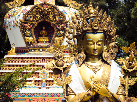 Close up detail of statues and stupa at Kopan Monastery temple garden in Kathmandu Nepal.の写真素材