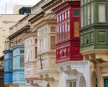 Street with colourful traditional wooden maltese balconies in Sliema, Maltaの写真素材