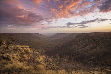 View from Grootberg plateau into the valley of the Klip River with a stunning sunset. Namibia, Africaの写真素材