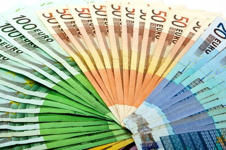 Different euro bills are on a table in the form of a money fanの写真素材
