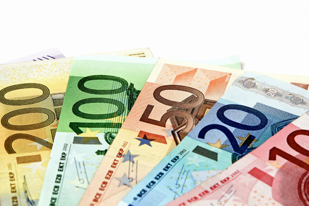 Different euro bills are spread out on a table in the form of a Geldfchers. の写真素材
