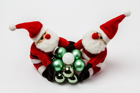 Two Nicholas hold small Christmas ballsの写真素材
