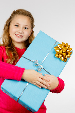 Girl is pleased about her presentの写真素材
