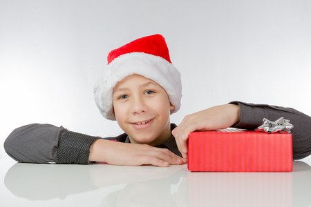 Boy is pleased about a present packed redの写真素材
