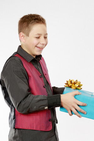 Boy gives a blue presentの写真素材