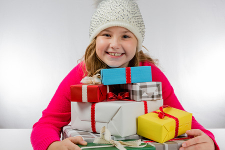 Girl is happy about Christmas presentsの写真素材