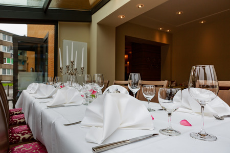 Laid tables reserved for dinersの写真素材