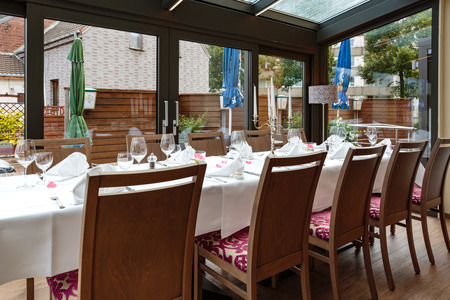 Laid tables reserved for dinersの写真素材