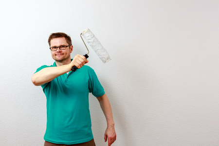 Man paints on imaginary concept wallの写真素材