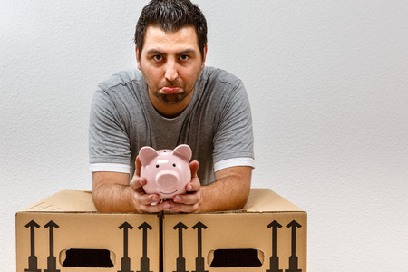 Expensive move, sad man, disappointed man, conceptの写真素材