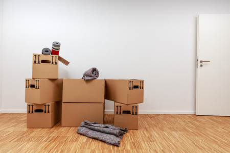 Moving boxes on parquet in new apartmentの写真素材