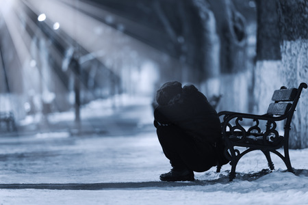 Depressed woman in front of a benchの写真素材