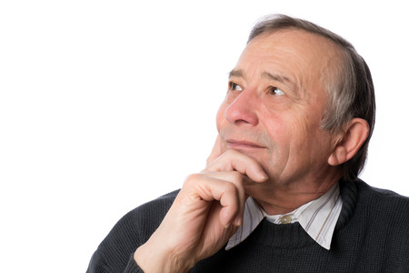 Mature man looking up with hope isolated on white