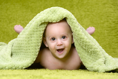 Cute baby with green backgroundの写真素材