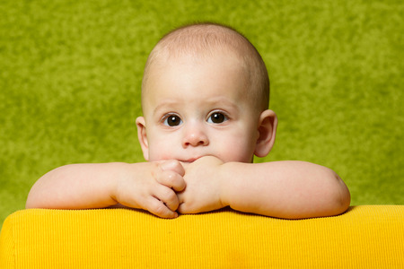 Cute baby with green backgroundの写真素材