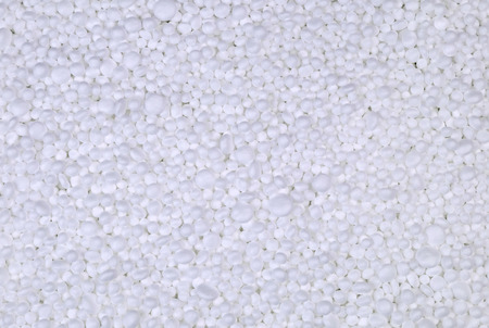 Background from filler of small white pieces of Styrofoam for packaging.
