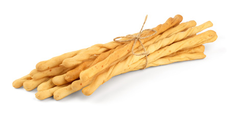 Toasted wheat long bread sticks, tied with a rope, isolated on a white background.の写真素材