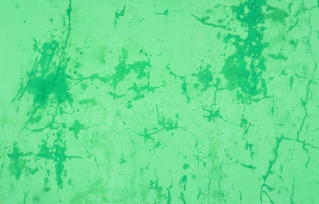 Old peeling plastered surface in green. For background and texture.の写真素材