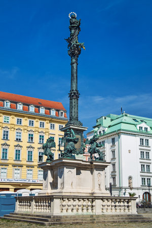 Vienna, Austria August 29, 2019: Marian Column monument or Mariensaule with the statue of the Virgin Mary and four cherubs, by Carlo Carlone. Located at Am Hof Platz square.のeditorial素材