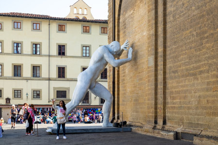 Florence, Italy - October 18, 2022: The monumental sculpture Arbitrium by Emanuele Giannelli, was temporary located at the wall of Basilica of San Lorenzo from September 2 to October 31, 2022.のeditorial素材