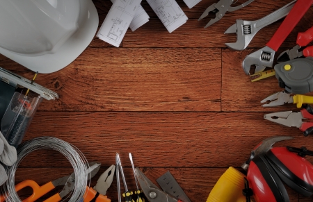 Construction equipments on wood background with copy space 