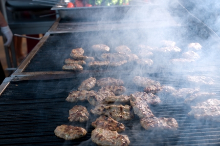 Pieces of meatball on barbecueの写真素材