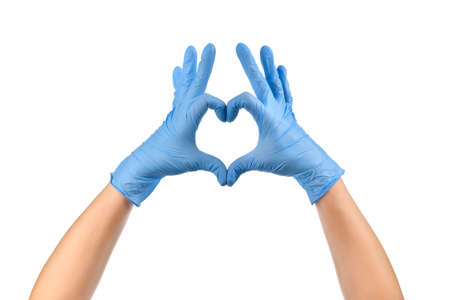 Doctor's hands in medical gloves in shape of heart on white background.