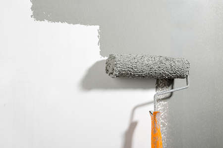 Painting Wall with Paint Rollerの写真素材