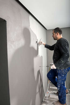 Applying Paint with Plastering Trowelの写真素材