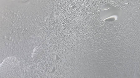 4K resolution Condensate steam from boiling water on misted glassの写真素材