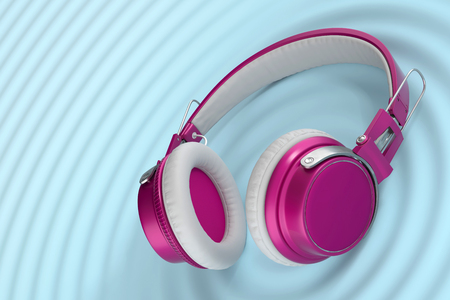 Funny bright wireless headphones isolated on blue surface with audio waves. 3d Conceptual illustrationの写真素材