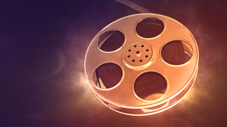Retro film reel on burn background. Closeup with area for a text. 3d illustration の写真素材