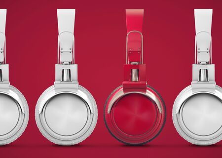 Unique red headphones among many others. Standing out from the crowd, individuality and the concept of difference. 
Ðudio music composition on a red background. 3d illustrationの写真素材