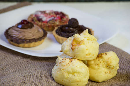 chocolate, strawberry and cream pies. space for text.の写真素材