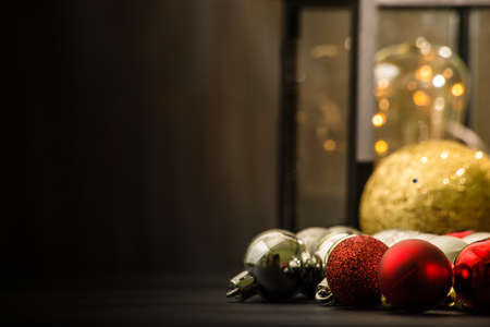 christmas ornaments on rustic table with black background.の写真素材