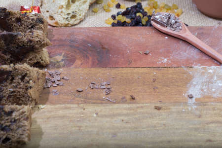 christmas panettone on rustic wooden table with space for text.の写真素材