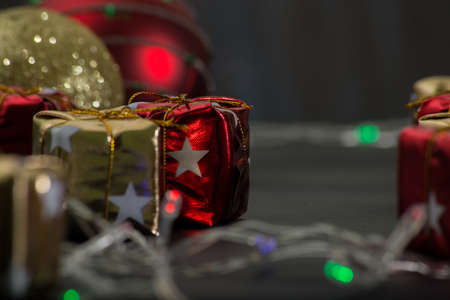 christmas ornaments on rustic table with black background.の写真素材