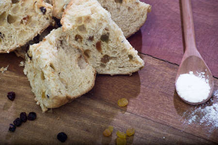 Christmas panettone on rustic table. some table decorations.の写真素材