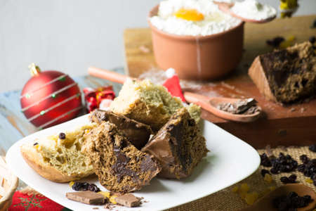 Christmas panettone on rustic table. some table decorations.の写真素材