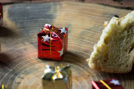 Christmas panettone on rustic table. some table decorations.の写真素材