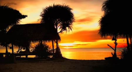 Dramatic beach sunrise の写真素材