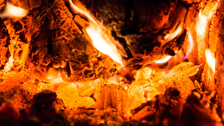 Burning wood and coal in the furnaceの写真素材