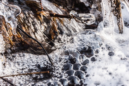 Frozen stream in icicles