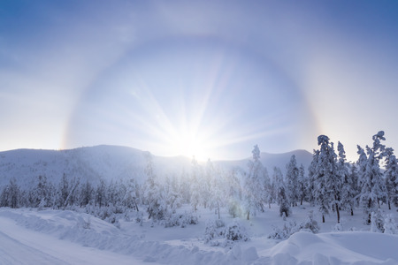 Halo effect over winter landscapeの写真素材