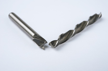 Broken drill bit for woodworking on white background.Shallow DOF