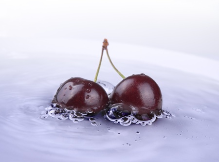 image of fresh cherry fruits in the water の写真素材