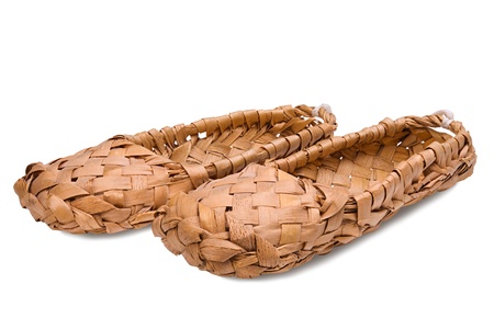 Old Russian bast shoes isolated on white backgroundの写真素材